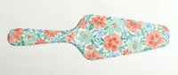 Floral paddle with coral and turquoise blooms on mint background, ideal for kitchen decor, cooking blogs, recipe websites, and culinary branding projects.