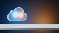 Glowing translucent cloud icon floating above white surface with colorful gradient background for technology and data storage concepts.