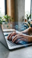 Hands typing on laptop with digital interface overlay showing connected devices and data visualization in modern office workspace with plants.