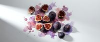 Fresh figs cut in half displaying red flesh with purple watercolor splashes on white background for culinary and food design projects.