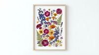 Pressed flower botanical art with colorful wildflowers and ferns arranged on white background, natural herbarium style composition for home decor.