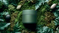 Dark green cosmetic jar surrounded by lush ferns and moss with decorative spheres, showcasing natural skincare packaging in forest-inspired setting.