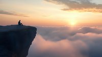Silhouette of person sitting on cliff edge above clouds at majestic sunset, dramatic mountain peak view with golden sun rays breaking through cloudscape.