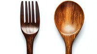Wooden fork and spoon isolated on white background. Traditional handcrafted bamboo kitchen utensils for eco-friendly cooking and serving.