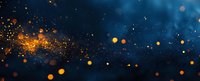 Glowing golden particles and bokeh lights scattered against deep blue background create magical atmosphere for festive designs and holiday backgrounds.