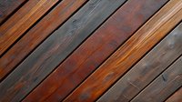 Diagonal wooden planks with rich brown and gray tones showing natural grain texture and weathered surface. Background for rustic design projects and architecture visuals.