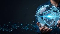 Businessman hands holding glowing digital globe with cybersecurity shield protection network connections on dark background for technology concepts.