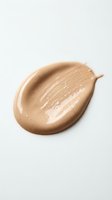 Liquid foundation makeup smear on white background showing smooth creamy texture for cosmetic and beauty product advertising.