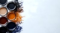 Colorful makeup pigments and loose powder scattered on white background with cosmetic containers arranged diagonally, creating artistic composition for beauty industry.