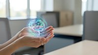 Hands holding glowing holographic brain with neural networks floating above palms in modern office environment for technology and innovation concepts.