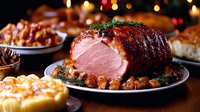 Succulent glazed ham with crispy edges, garnished with herbs, served on ceramic plate amid festive holiday dinner setting with side dishes and warm ambient lighting.