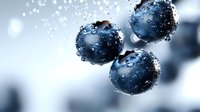 Fresh ripe blueberries with water drops on blue background, macro shot showing juicy texture and natural freshness. For food industry and healthy eating concepts.