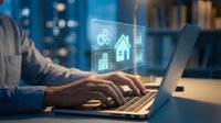 Professional using laptop with holographic smart home interface displaying energy efficiency icons and data analytics in modern office environment.