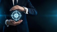 Professional businessman in suit protecting digital GDPR compliance icons with hands showing data privacy security concept for corporate presentations.