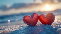 Two red heart decorations on sparkling snow at sunset with bokeh lights and blurred winter background, romantic Valentine's Day concept for greeting cards and designs.