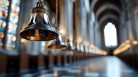 Bronze church bells hanging in row along gothic cathedral corridor with stained glass windows and arched ceiling, dramatic lighting creates spiritual atmosphere.