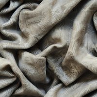 Soft beige fabric with delicate texture and gentle folds creates elegant waves and shadows, suitable for luxury fashion and interior design backgrounds.