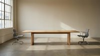 Modern minimalist conference room with wooden table and leather chairs in neutral office space for business meetings and corporate presentations.