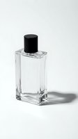 Clear glass perfume bottle with black cap isolated on white background for cosmetic product design and branding projects.