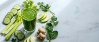 Fresh green smoothie with cucumber, celery, spinach and ginger on marble background. Healthy detox drink with organic vegetables for wellness lifestyle.