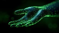 Glowing green hand silhouette with sparkling particles and bokeh effect against dark background creates magical atmosphere for fantasy and technology concepts.