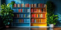 Colorful bookshelf against blue wall with vibrant books arranged by color spectrum, flanked by lush green houseplants in decorative pots.