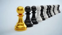 Golden chess pawn leading row of black and white pawns in strategic business leadership concept on white background.