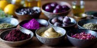 Natural colorful food pigments and spices in ceramic bowls on wooden table. Organic dyes from fruits, vegetables and herbs for healthy cooking and food coloring.