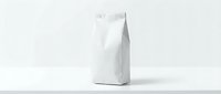 White paper bag mockup standing on clean surface with minimalist background for branding and packaging design projects.