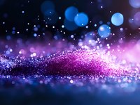 Magical purple and blue glitter scattered on dark surface with bokeh light effects creates dreamy abstract background for festive designs and celebrations.