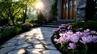 Sunlit stone path leading to gothic church entrance with blooming pink cyclamen flowers along curved walkway, morning sunburst through trees creates dramatic lighting.