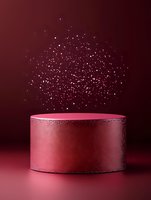 Glowing pink cylinder podium with sparkling silver particles falling from above on dark burgundy background. Luxury product display platform for cosmetics or jewelry.