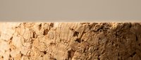 Ancient weathered adobe clay brick wall texture showing natural erosion patterns and earthy brown surface details for construction and architectural projects.