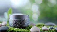 Moisturizing cream jar with water drops on green moss background with stones and soft bokeh lights, cosmetic product photography for spa and beauty.
