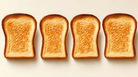 Four golden brown toasted bread slices arranged in row on beige background, breakfast food concept for bakery menu design and culinary projects.