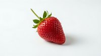 Fresh red strawberry with green leafy crown isolated on white background, suitable for food packaging, recipe blogs, and culinary design projects.