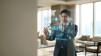 Professional businessman interacting with futuristic holographic data interface displaying charts and analytics in modern office environment.