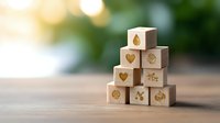 Wooden blocks with eco and nature symbols arranged in pyramid shape on natural background with soft bokeh lights, sustainable lifestyle concept.