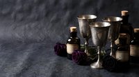 Vintage silver goblets with dried purple roses on dark textured background creating elegant gothic atmosphere for luxury dining and romantic occasions.