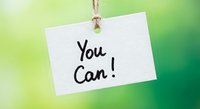 Motivational white paper tag with You Can handwritten message hanging on rope against green gradient background for inspiration and encouragement concepts.