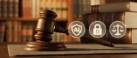 Wooden gavel and law books with legal icons representing justice, security and protection in courtroom setting for legal services and attorney concepts.