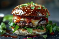 Gourmet burger with melted cheese, caramelized onions and fresh arugula on brioche bun, topped with sesame seeds and herbs. Close-up shot with selective focus.