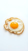 Crispy fried egg with golden yolk and lacy edges isolated on white background for breakfast menu design and culinary projects.