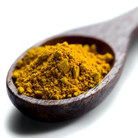 Ground turmeric powder in wooden spoon on white background, bright yellow organic spice macro photography showing texture and detail for cooking and wellness.