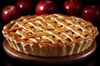 Fresh baked apple pie with lattice crust on wooden serving plate, garnished with whole red apples in dark moody background, close up view of homemade pastry.