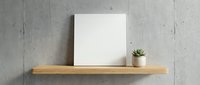 Blank white canvas and small succulent plant on wooden floating shelf against concrete wall for modern minimalist home decor and interior design mockup.