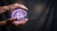 Male hands with medium skin tone holding a glowing purple brain hologram, representing artificial intelligence, neuroscience, mental health, and innovative technology concepts for business and medical applications.