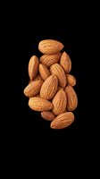 Pile of whole almonds isolated on transparent background, ready for use in t-shirt designs, clipart, stickers, print-on-demand products, and sublimation projects.