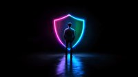 Silhouette of businessman standing in front of glowing neon shield symbol on dark background with colorful reflection, representing digital security and protection.