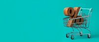 Miniature shopping cart filled with brown woven hats against turquoise background, representing retail, commerce, and seasonal shopping for fashion accessories.